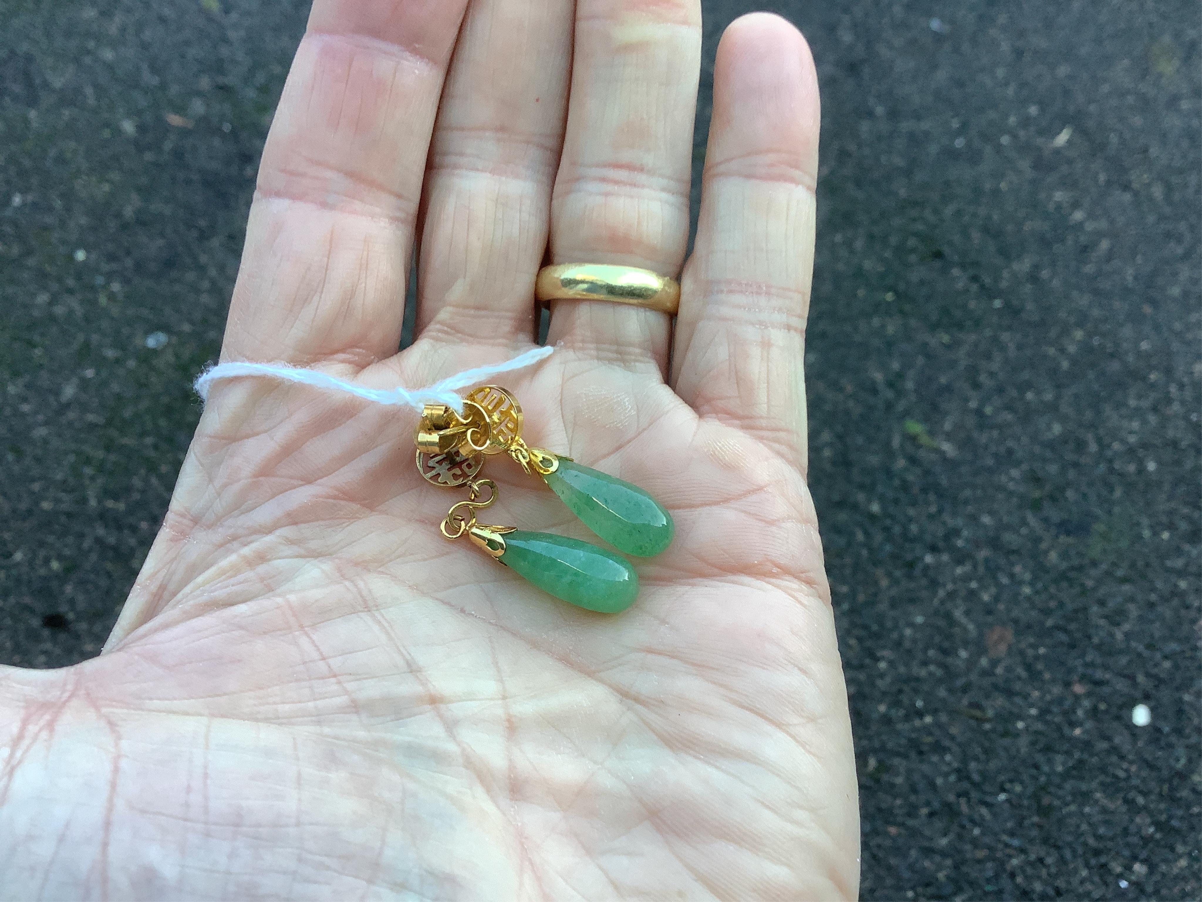 A pair Chinese yellow metal and teardrop shaped jade earrings, 42mm, gross weight 5.1 grams. Condition - fair to good